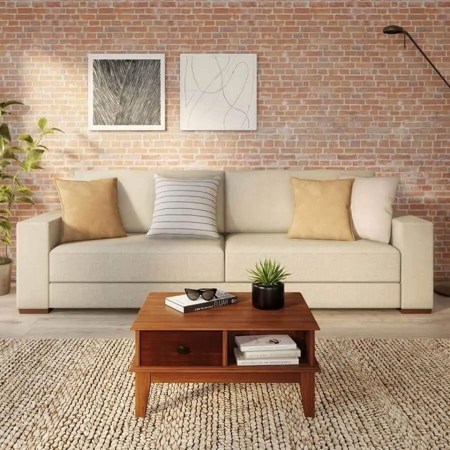 sala com sofá bege decorada com parede de tijolinho Foto Pinterest