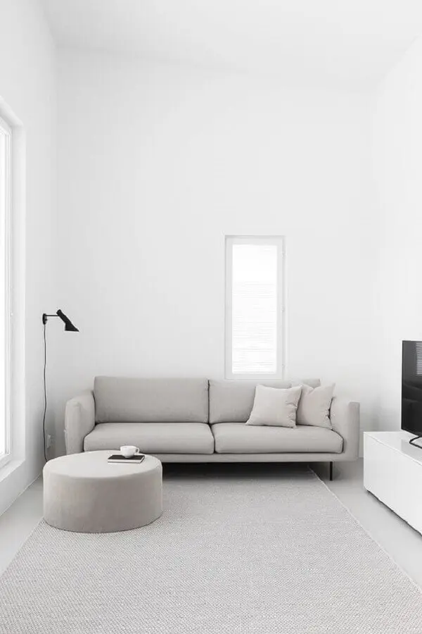 sala de estar minimalista decorada com luminária de parede Foto Pinterest