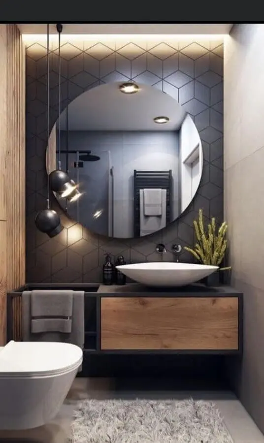 decoração moderna para banheiro social pequeno com revestimento hexagonal cinza escuro Foto Pinterest