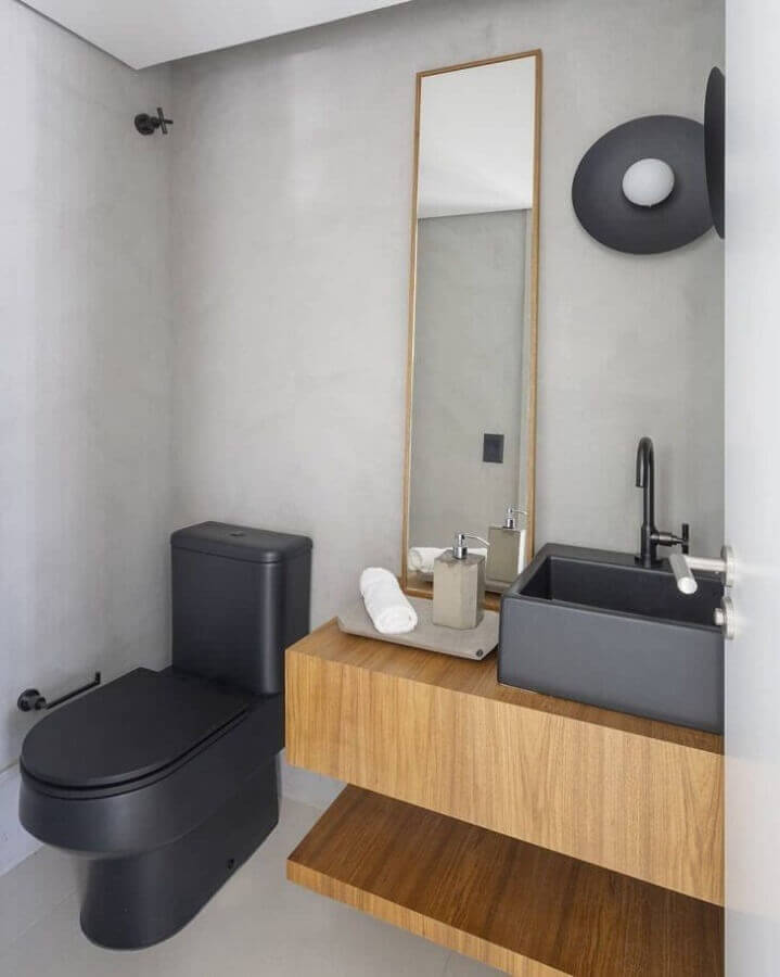 banheiro em cimento queimado decorado com gabinete de madeira suspenso Foto Rua 141 Arquitetura
