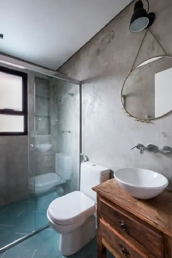 piso azul e gabinete rústico para decoração de banheiro com parede de cimento queimado Foto Pinterest
