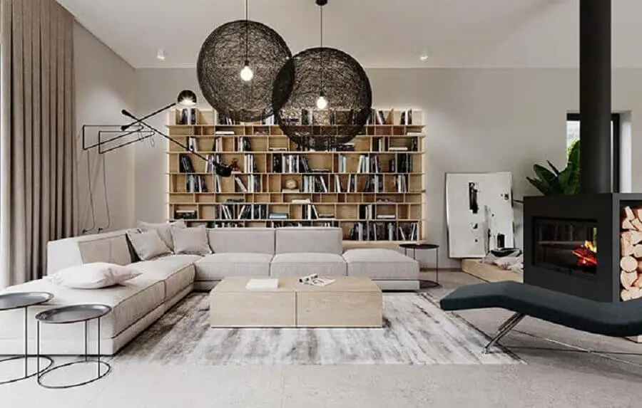 decoração de sala de visita moderna com lareira preta e estante de livros Foto Pinterest
