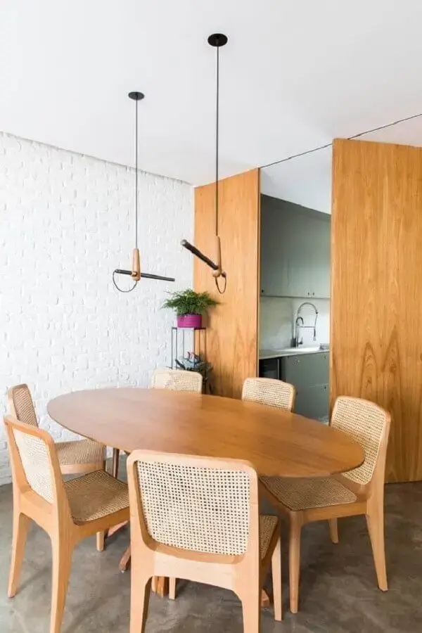 decoração minimalista com mesa oval e luminária para sala de jantar moderna Foto Pinterest