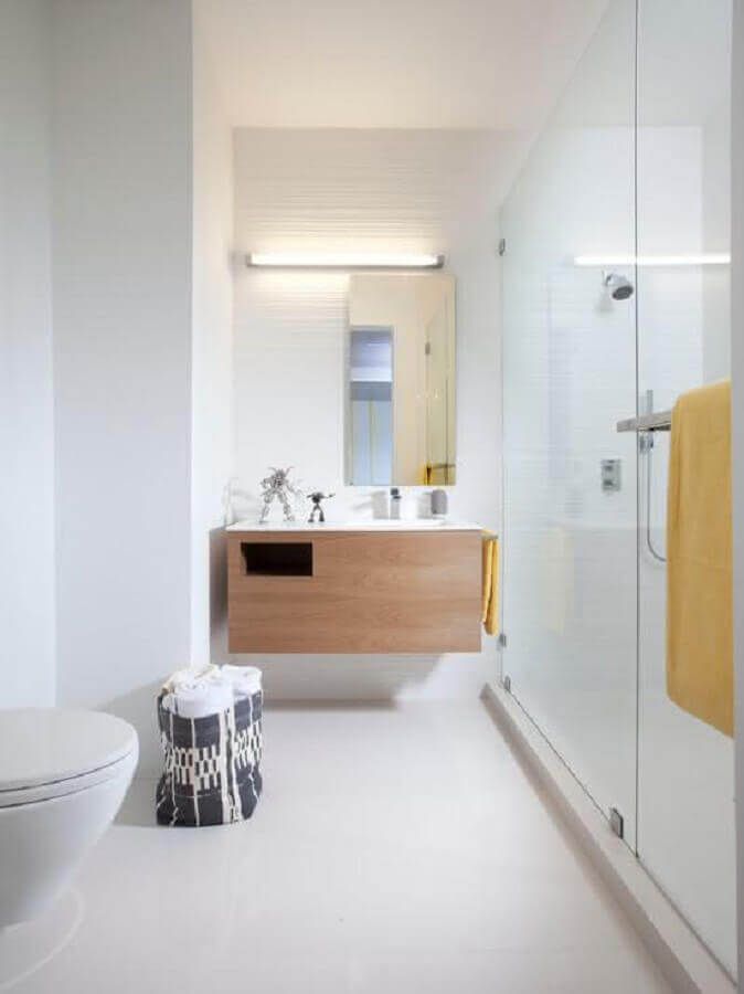 ideias para banheiro minimalista decorado com gabinete de madeira suspenso Foto Pinterest