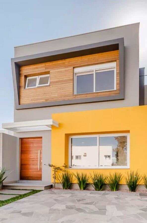 Ideia de cores de casas modernas externa com fachada cinza e amarela Foto Decor Facil