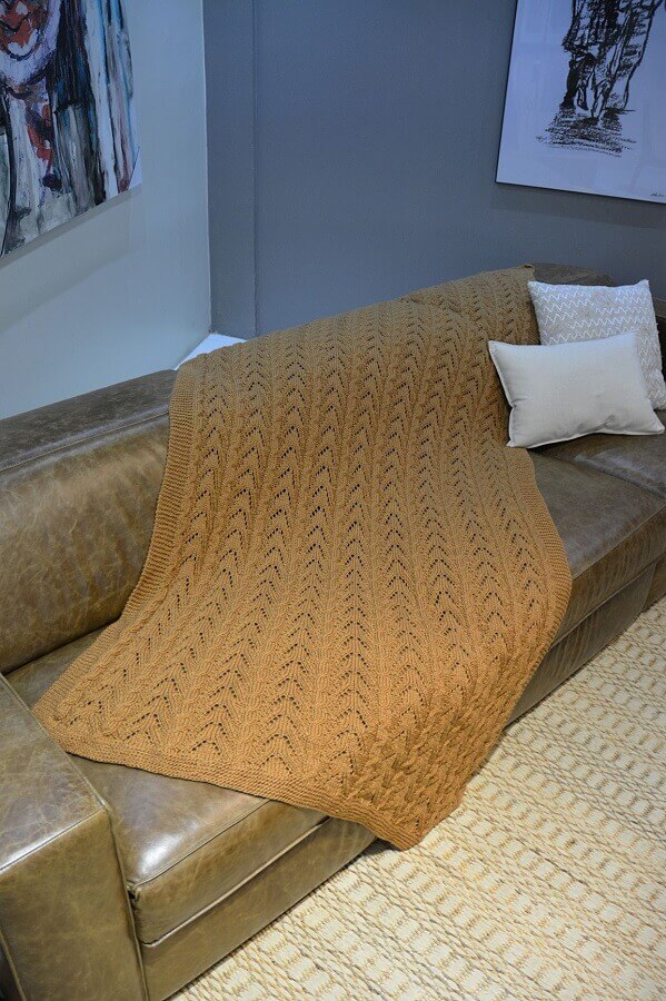 Decoração simples para sala com manta de crochê Foto Circulo