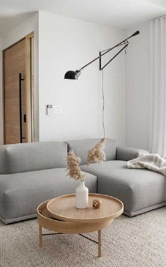 Sofá moderno para decoração clean de sala de estar com luminária articulada Foto Futurist Architecture