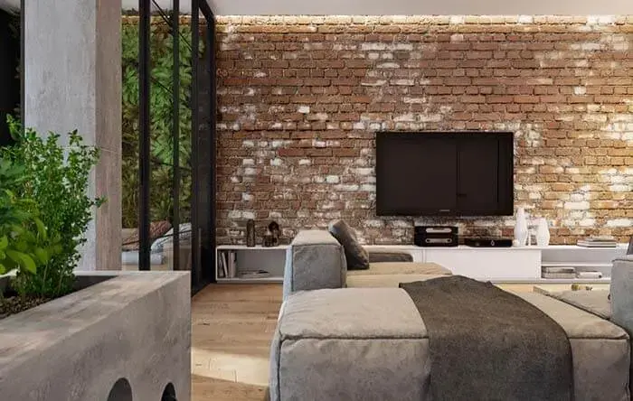 A parede de tijolo de demolição revestimento traz um charme para sala de estar. Fonte: El Comércio Perú