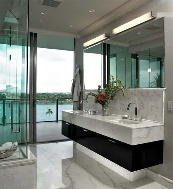 Pia de banheiro de mármore branco com gabinete preto