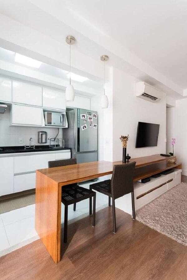 Decoração clean de apartamento com cozinha e sala juntas 